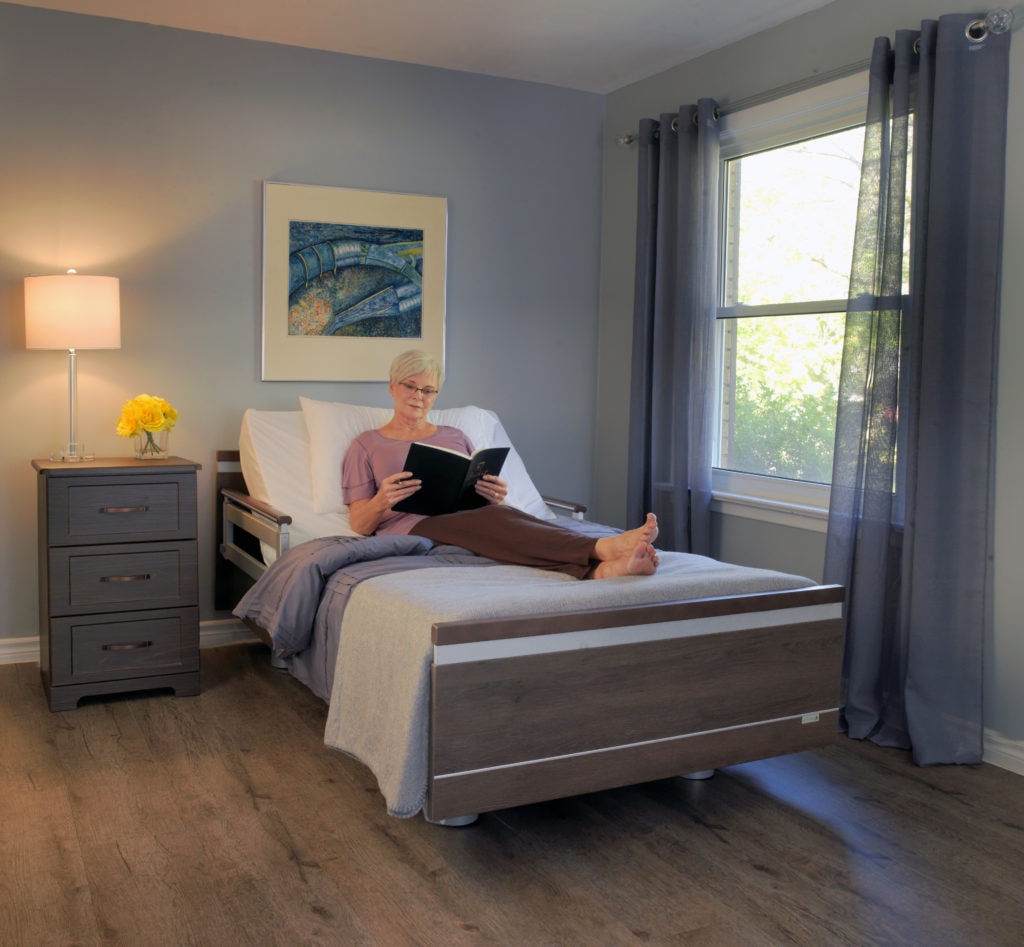 lady sitting on bed reading a book